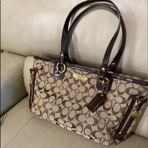 Coach logo purse with brown trim